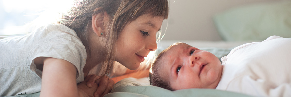 5 Moves to Help Your Older Child Bond with Your Newborn